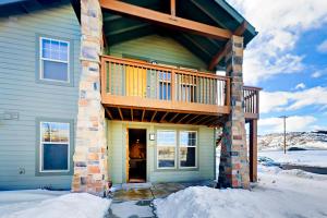 a house with a deck on top of it at Redstone Retreat Unit A in Park City