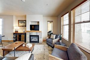 a living room with a couch and a fireplace at Redstone Retreat Unit A in Park City