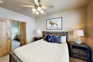 a bedroom with a bed and a ceiling fan at Redstone Retreat Unit A in Park City