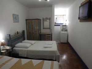 
Cama ou camas em um quarto em Pouso das Gerais
