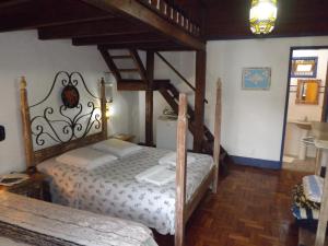 a bedroom with two twin beds in a room at Pouso das Gerais in Tiradentes +76 photos