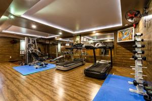 a gym with several treadmills and machines in a room at SaiGon Huch Villa in Ho Chi Minh City