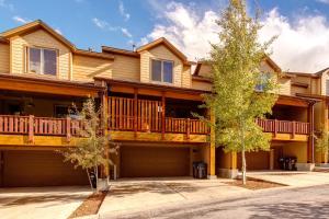 a large house with a deck and a driveway at Bobsled Haven in Park City