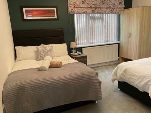 Кровать или кровати в номере Room in Guest room - Family room with private bathroom