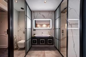 a bathroom with a sink and a mirror at Berjer Boutique Hotel & Spa in Istanbul