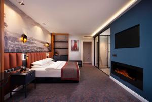 a hotel room with a bed and a fireplace at Berjer Boutique Hotel & Spa in Istanbul