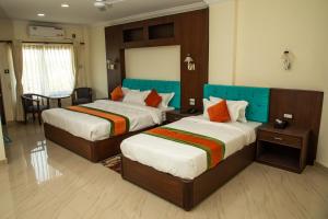 Gautam Buddha Airport Hotel客房内的一张或多张床位
