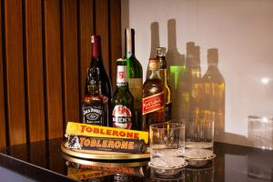 a group of bottles of alcohol sitting on a table with glasses at Berjer Boutique Hotel & Spa in Istanbul