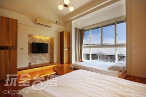 Postel nebo postele na pokoji v ubytování Miaoli Sanyi Bo Wu Guan Homestay