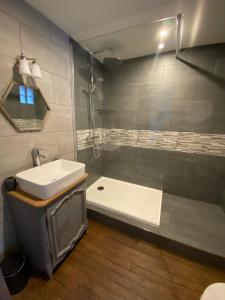 a bathroom with a sink and a bath tub at La Bastide Du Bonheur Chambres et Tables D'Hôtes in Ger +21 photos