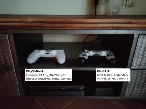 two video game controllers sitting on top of a tv at Nikolina Rab Apartments in Rab +35 photos