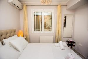 A bed or beds in a room at Elena's apartment 3