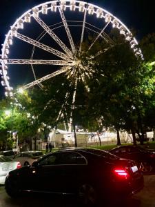 a large ferris wheel in a park at night at Corso Quiet in Budapest