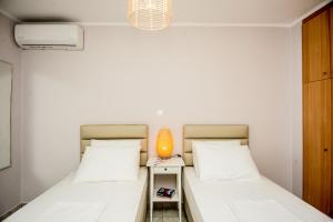 A bed or beds in a room at Elena's apartment 3