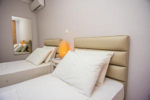 A bed or beds in a room at Elena's apartment 3