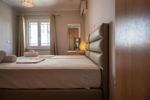 A bed or beds in a room at Elena's apartment 3