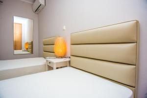 A bed or beds in a room at Elena's apartment 3