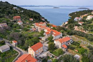 an aerial view of a village on a hill with water at Villa Kana - Mediterranean holiday home in Sali