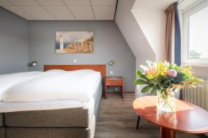 Voodi või voodid majutusasutuse Two Brothers Hotel Astoria toas