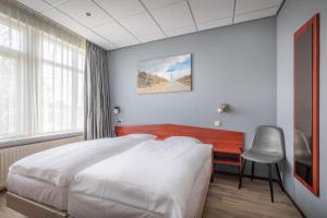 Voodi või voodid majutusasutuse Two Brothers Hotel Astoria toas