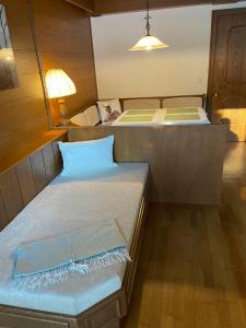 A bed or beds in a room at FerienWohnung Weer