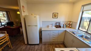 A kitchen or kitchenette at Barossa Country Cottages