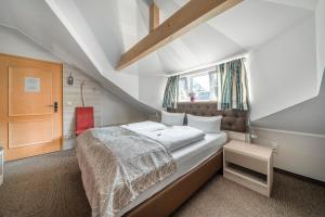 Postel nebo postele na pokoji v ubytování Hotel Villa am Waldschlösschen