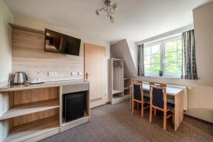 Kuchyň nebo kuchyňský kout v ubytování Hotel Villa am Waldschlösschen