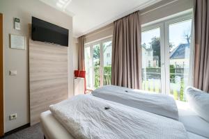 Postel nebo postele na pokoji v ubytování Hotel Villa am Waldschlösschen