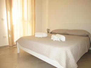 A bed or beds in a room at Appartamento Carlo Alberto
