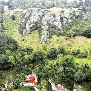 a house on the side of a mountain at La tanière Dinant in Dinant