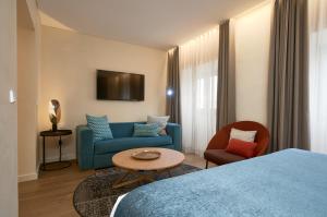 TV a/nebo společenská místnost v ubytování Suites Murillo Plaza Sta. Cruz