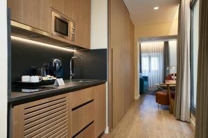 Kuchyň nebo kuchyňský kout v ubytování Suites Murillo Plaza Sta. Cruz