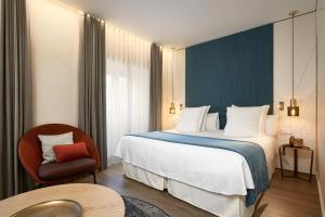 Postel nebo postele na pokoji v ubytování Suites Murillo Plaza Sta. Cruz + 37 fotografií