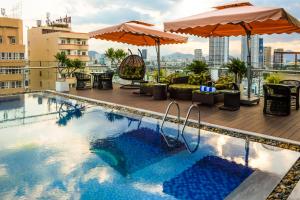 a swimming pool on the roof of a building at Nagila Boutique Hotel in Da Nang