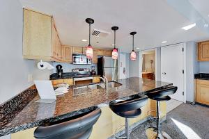 a kitchen with a counter with stools in it at Lowell Haven 267 in Park City