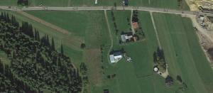 an aerial view of a house in a field at Apartament Grel in Nowy Targ