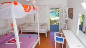 Postel nebo postele na pokoji v ubytování Lily Palm Resort