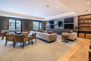 a living room filled with furniture and a flat screen tv at The Lift 309 in Park City