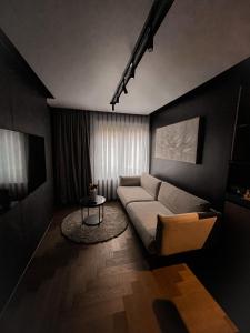 a living room with a couch and a table at Black Diamond in Zurich
