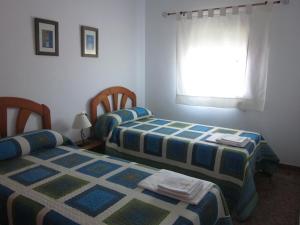 Postel nebo postele na pokoji v ubytování Apartamento La Torre + 4 fotografie