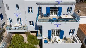 an overhead view of a building with blue and white at Aeginia 2 in Perdika