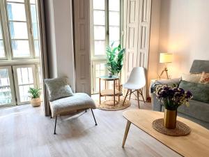 Posedenie v ubytovaní Homely Málaga Loft Especerías