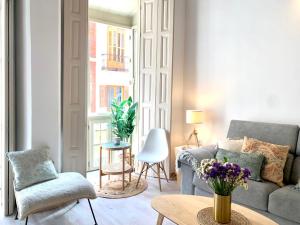 Posedenie v ubytovaní Homely Málaga Loft Especerías