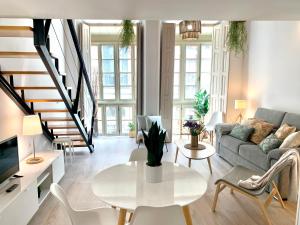 Posedenie v ubytovaní Homely Málaga Loft Especerías
