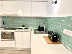 Kuchyňa alebo kuchynka v ubytovaní Homely Málaga Loft Especerías