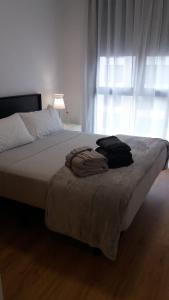 En eller flere senge i et værelse på Apartamento Villa Pepita + 14 billeder