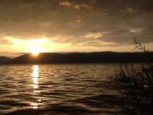 a sunset over a large body of water at 大理涵墅 HillSea in Dali +8 photos