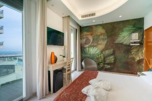 TV a/nebo společenská místnost v ubytování Hotel Stella D'Oro