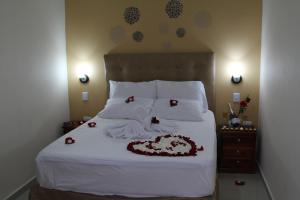 Postel nebo postele na pokoji v ubytování Azuán Suites Hotel By GEH Suites